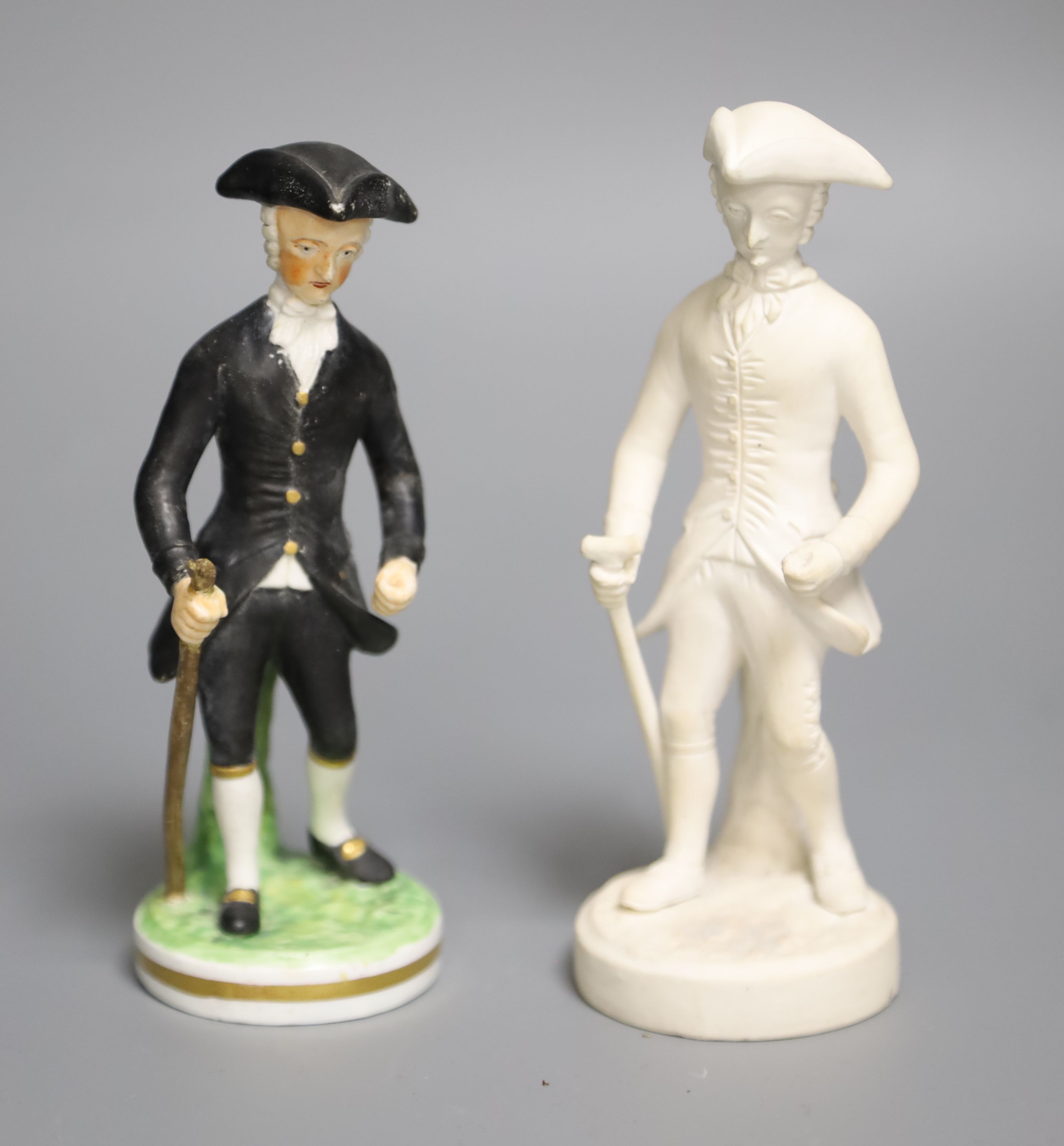 An early 19th century Derby rare biscuit figure of Dr. Syntax Walking and a later modelled Derby King Street of the same figure, 14cm